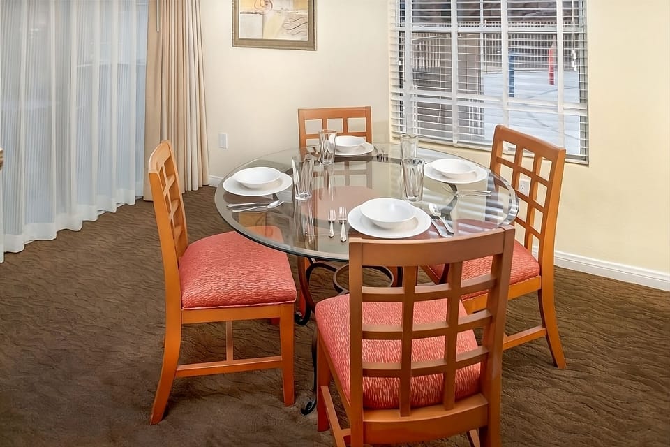 Savor shared meals around the bright, set dining table.
