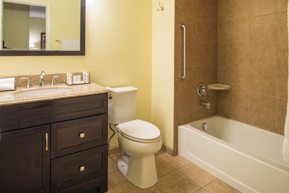 Refresh with a bright vanity and shower-tub combo.