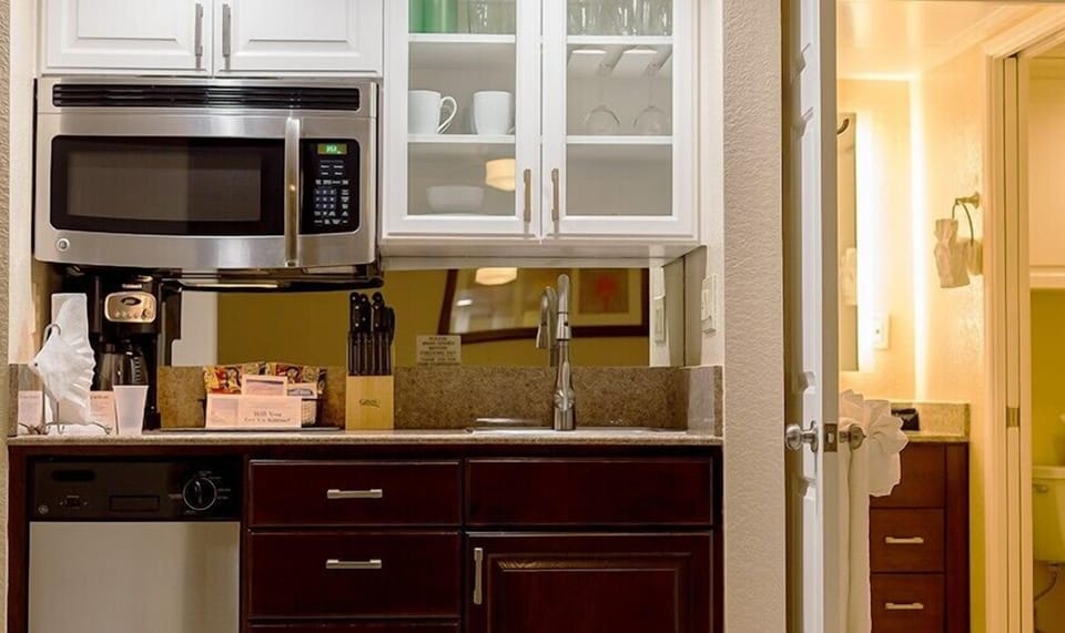 Start mornings easily with microwave, coffee setup, and prep space.