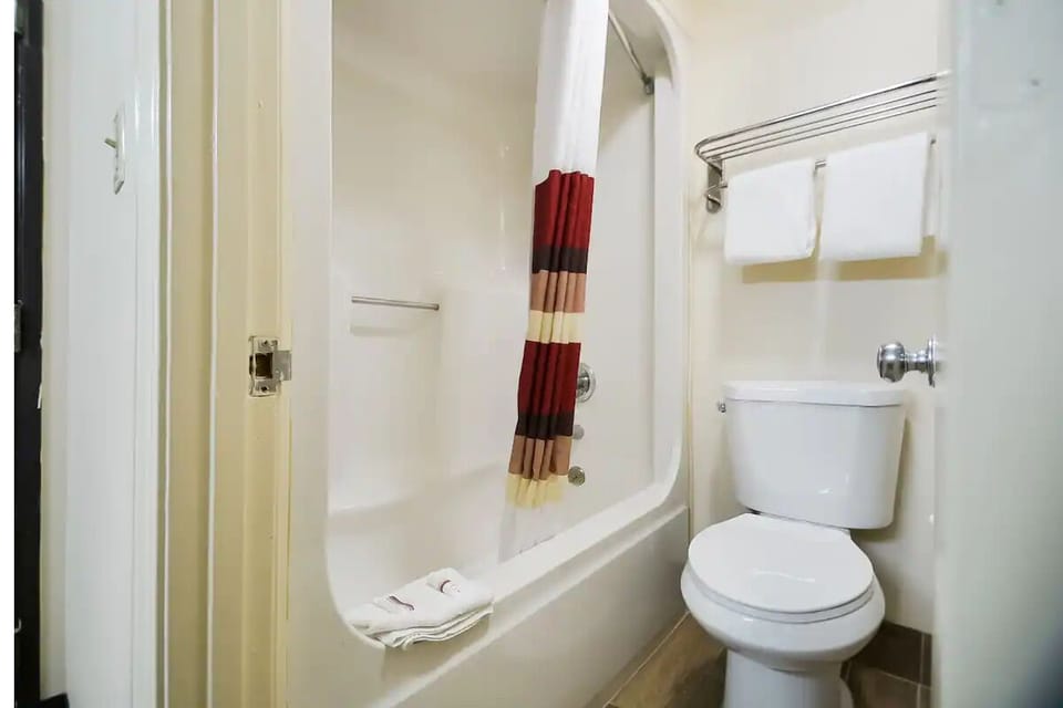 Refresh with a clean tub-shower combo and fluffy towels.