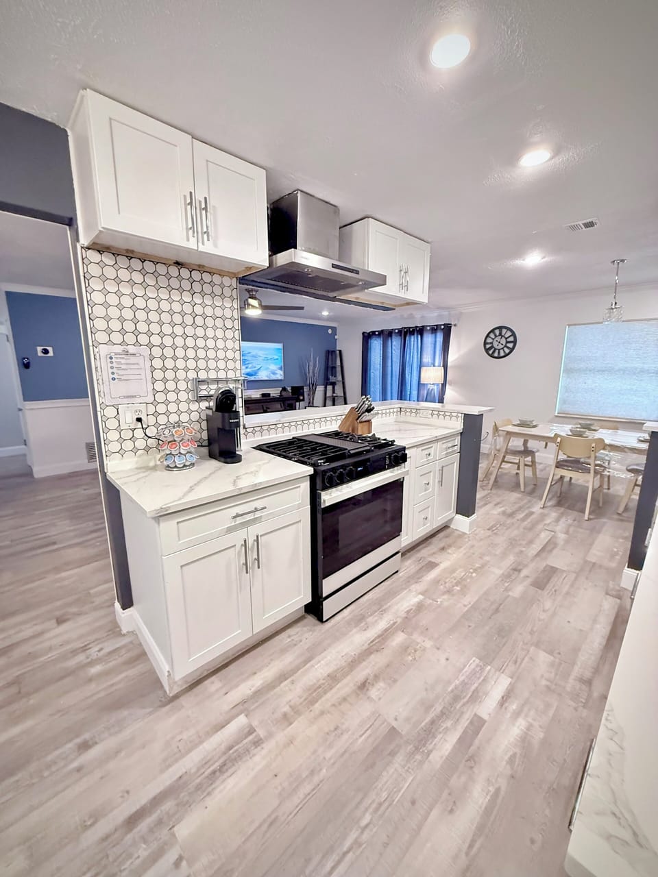 Bright modern kitchen with stylish finishes and open dining flow