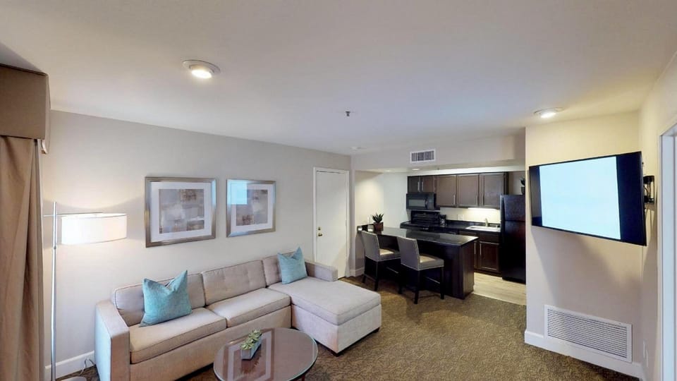 Gather on the sectional, then enjoy meals from the kitchen.