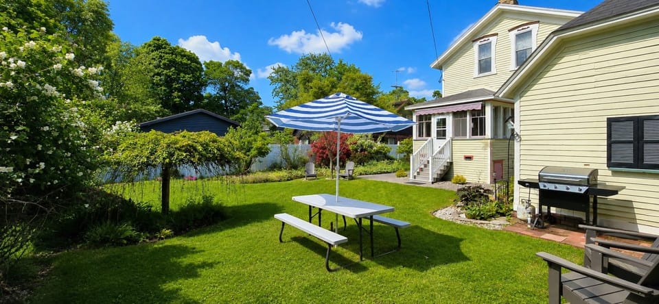 Backyard, propane grill, picnic tables, Adirondack chairs