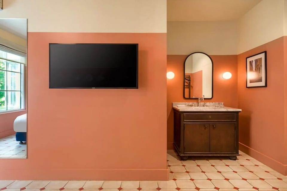 Refresh at the polished vanity with warm, flattering light.