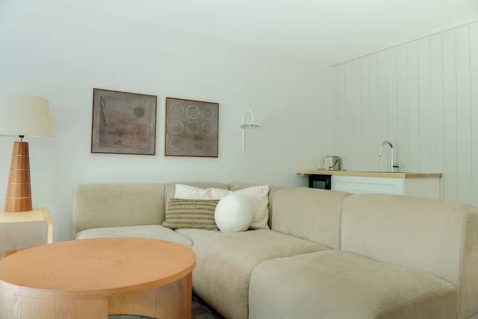 Sip morning coffee in a bright, minimalist lounge nook.