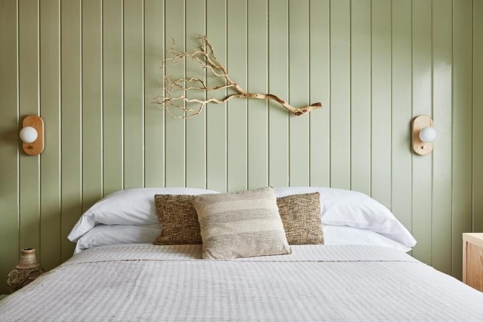 Relax into layered pillows for an extra-comfortable night’s sleep.