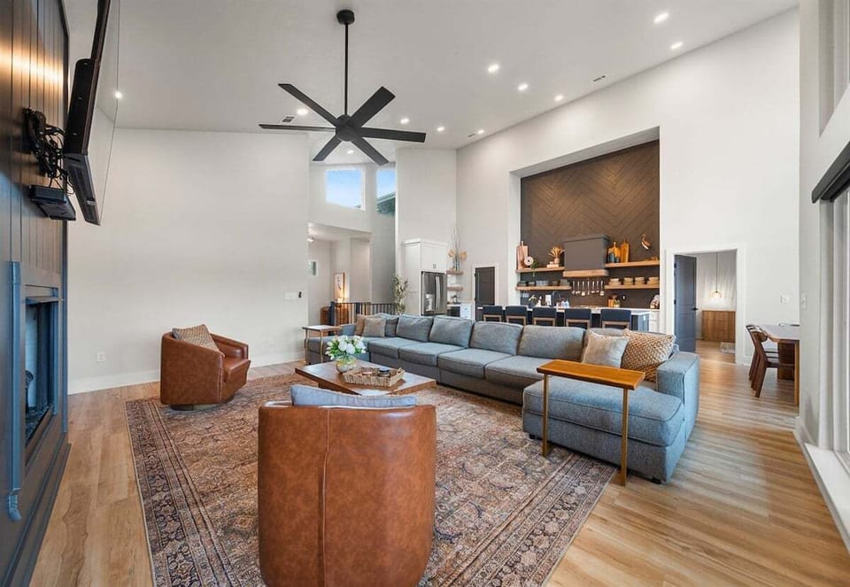 The living room offers a stylish yet comfortable place to unwind, with plush sofas, natural light pouring in, and thoughtful touches that make it feel instantly like home.