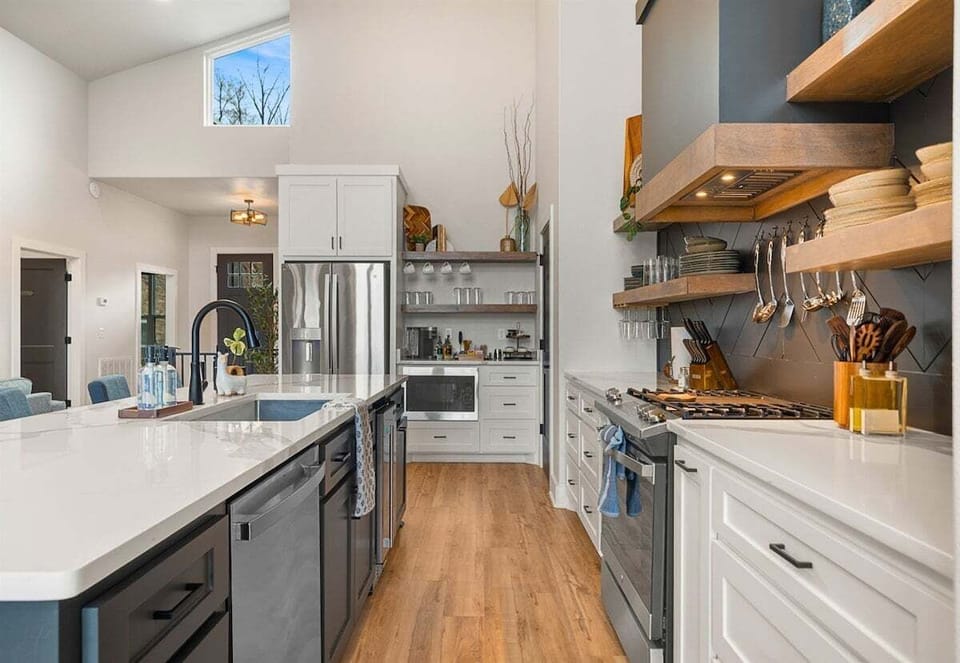 With ample cabinetry and modern finishes, this kitchen blends clean design with practical storage and workspace.