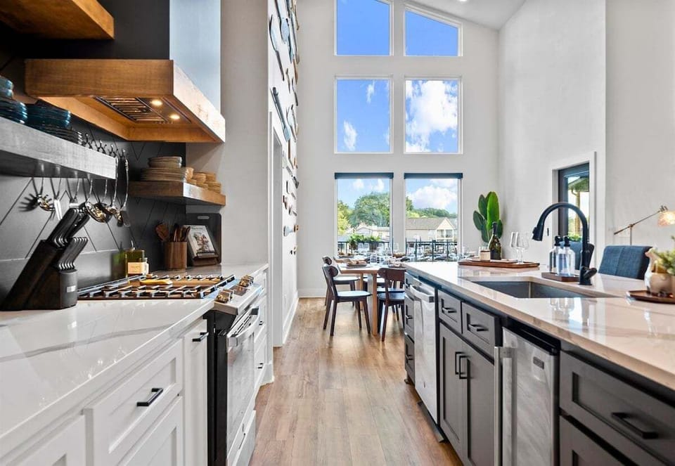 Here's another look at the kitchen's expansive island and modern cabinetry, offering plenty of seating for morning coffee or evening cocktails.
