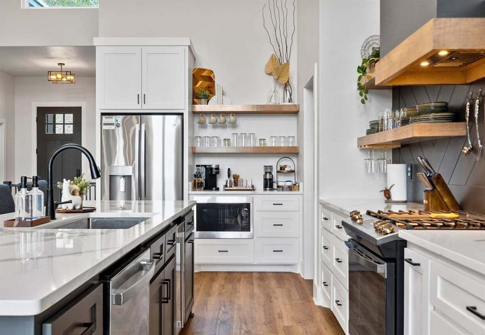 With ample cabinetry and modern finishes, this kitchen blends clean design with practical storage and workspace.