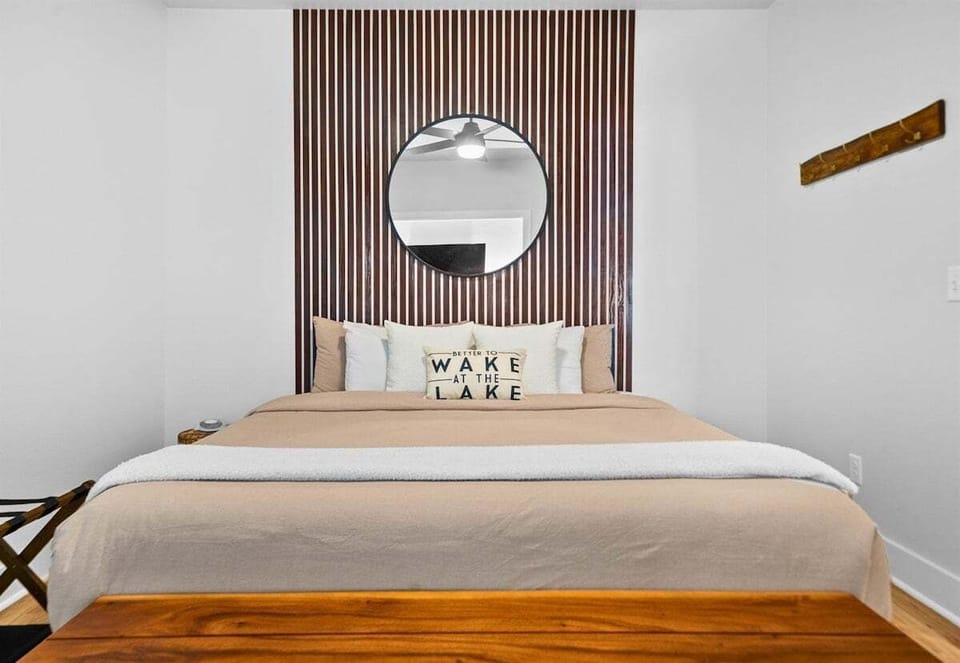 With warm accent walls and thoughtful details, this bedroom offers a comfortable and private retreat.