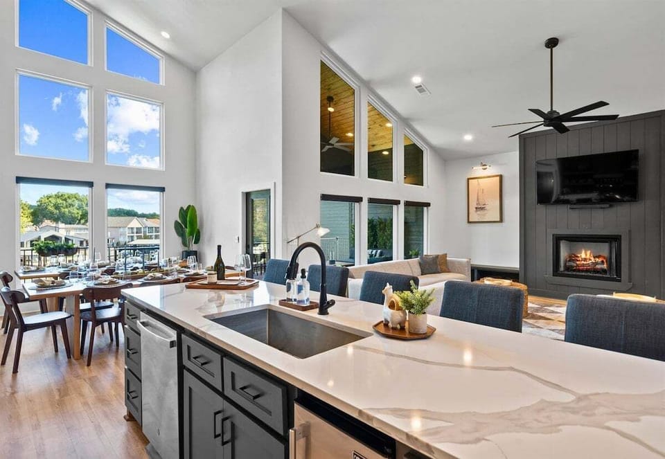 The bright and airy kitchen features high-end appliances, generous counter space, and an open design that keeps everyone connected.