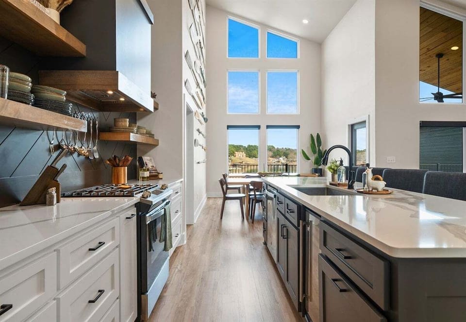 Here's another look at the kitchen's expansive island and modern cabinetry, offering plenty of seating for morning coffee or evening cocktails.