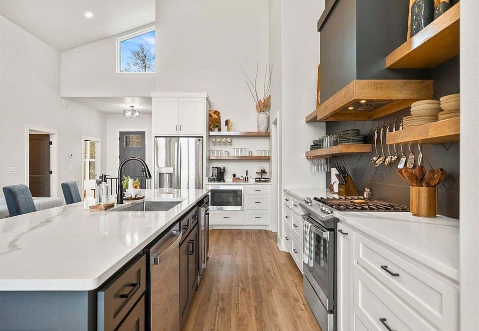 With ample cabinetry and modern finishes, this kitchen blends clean design with practical storage and workspace.