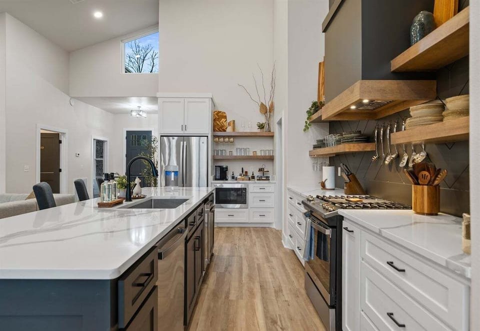 With ample cabinetry and modern finishes, this kitchen blends clean design with practical storage and workspace.
