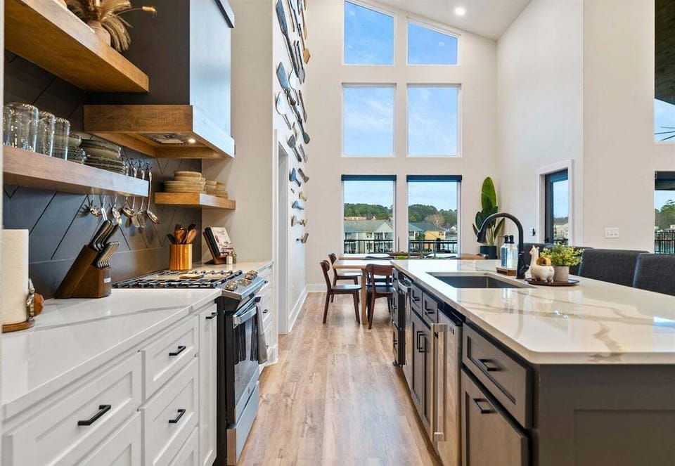 Here's another look at the kitchen's expansive island and modern cabinetry, offering plenty of seating for morning coffee or evening cocktails.