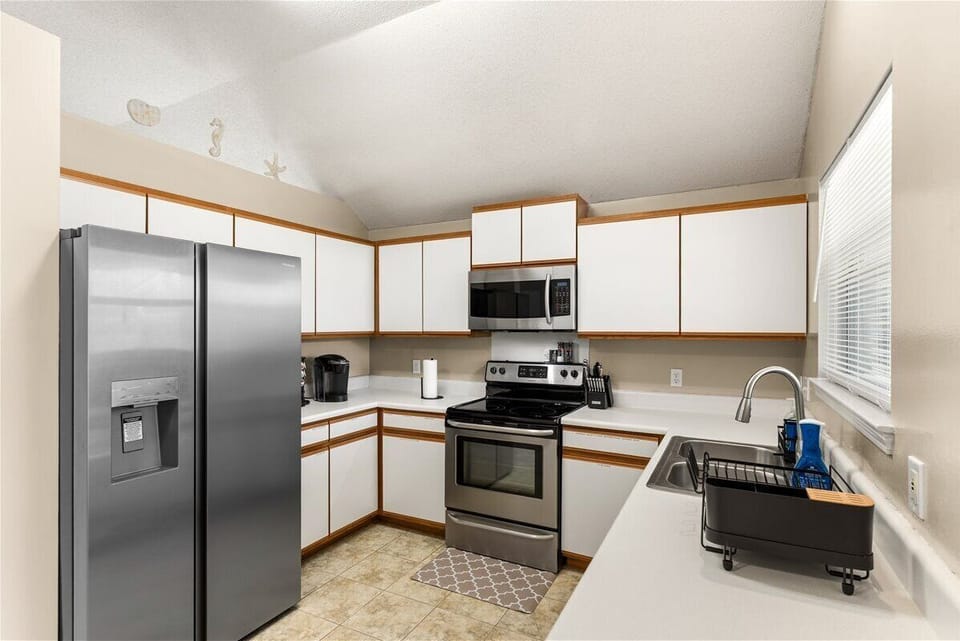 Fully equipped kitchen with stainless steel appliances, plenty of counter space, and everything you need to prepare meals during your stay.