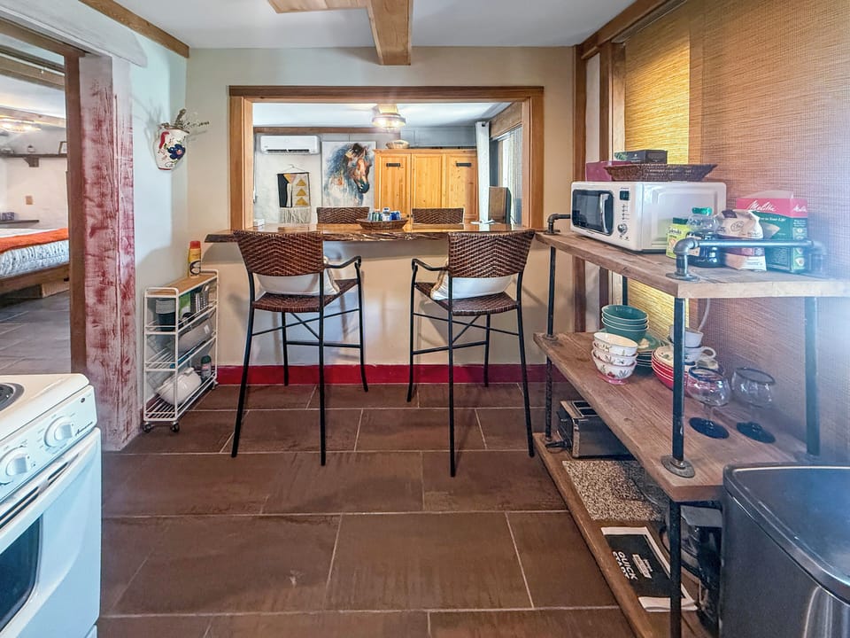 Cozy kitchen with breakfast bar and rustic wood accents