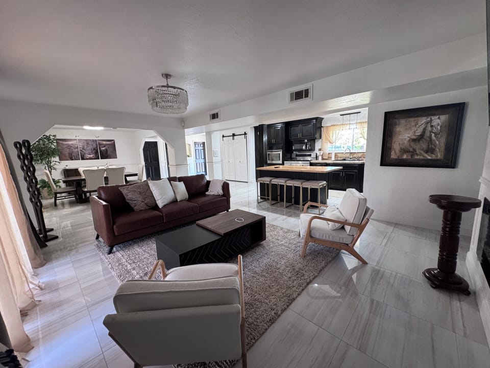 Living area & kitchen with island an extra seating