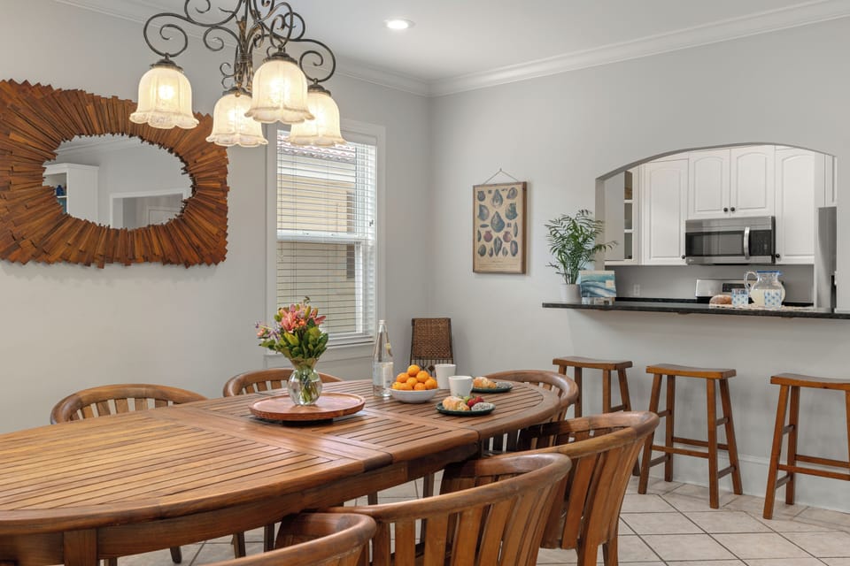 High-backed chairs and a wrought-iron chandelier add a touch of sophistication.
