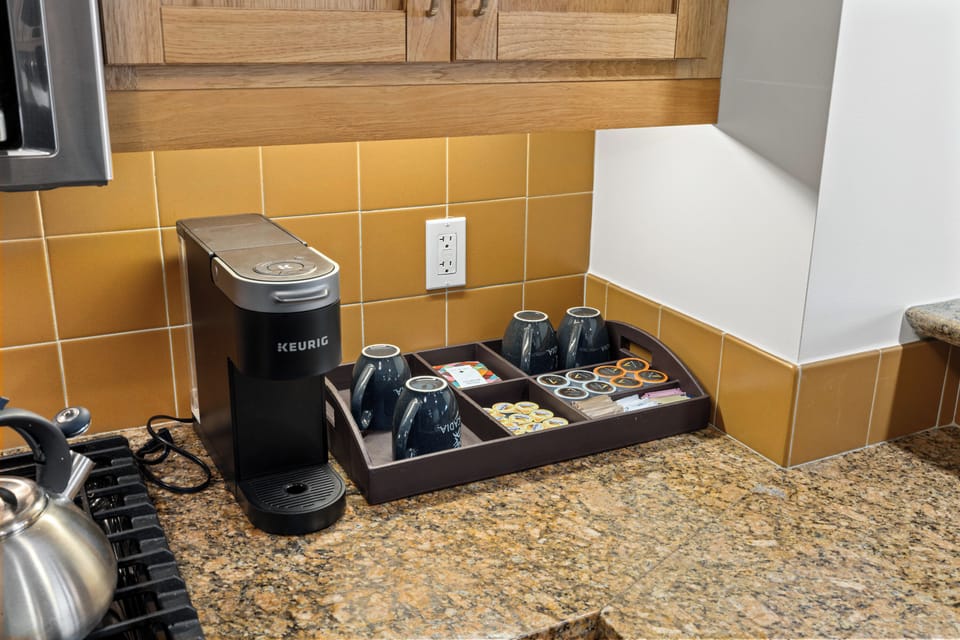 Start your mornings right with the in-unit coffee maker, perfect for brewing a fresh cup while taking in the tranquil forest views.