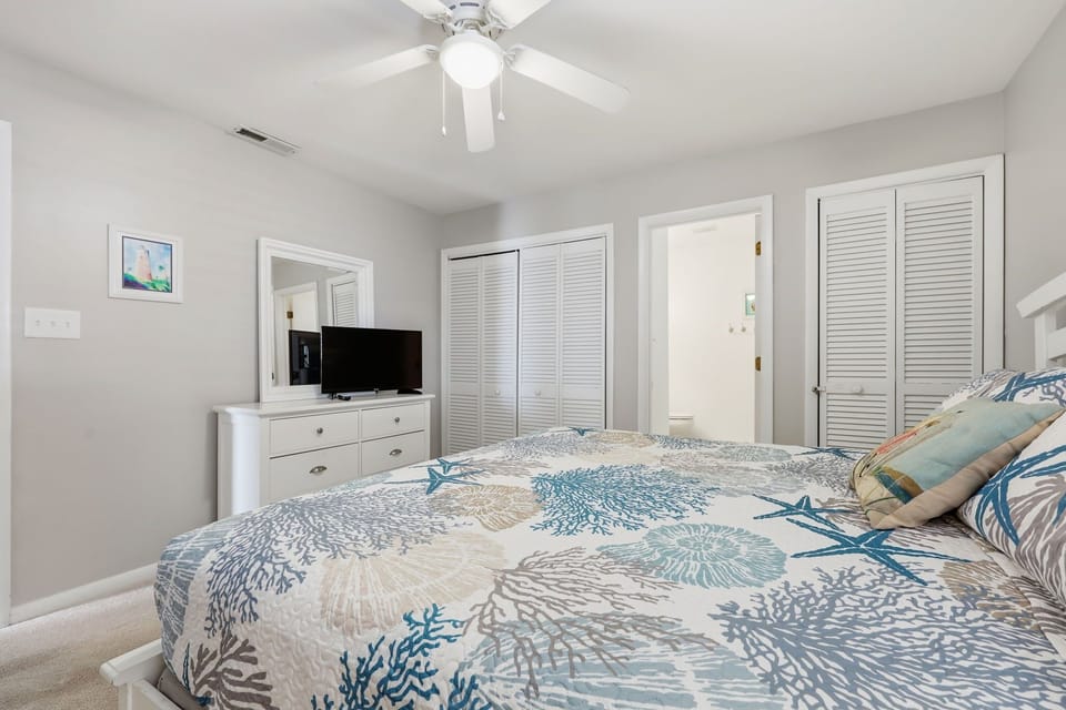 Primary bedroom with King bed, dresser & closet