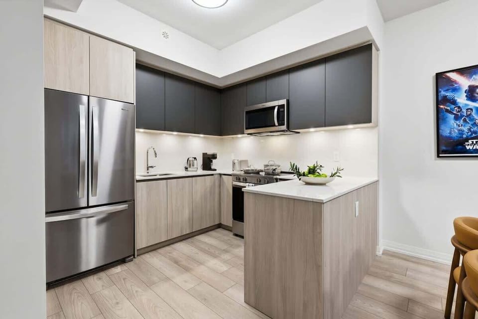 Modern kitchen with stainless steel appliances and sleek finishes