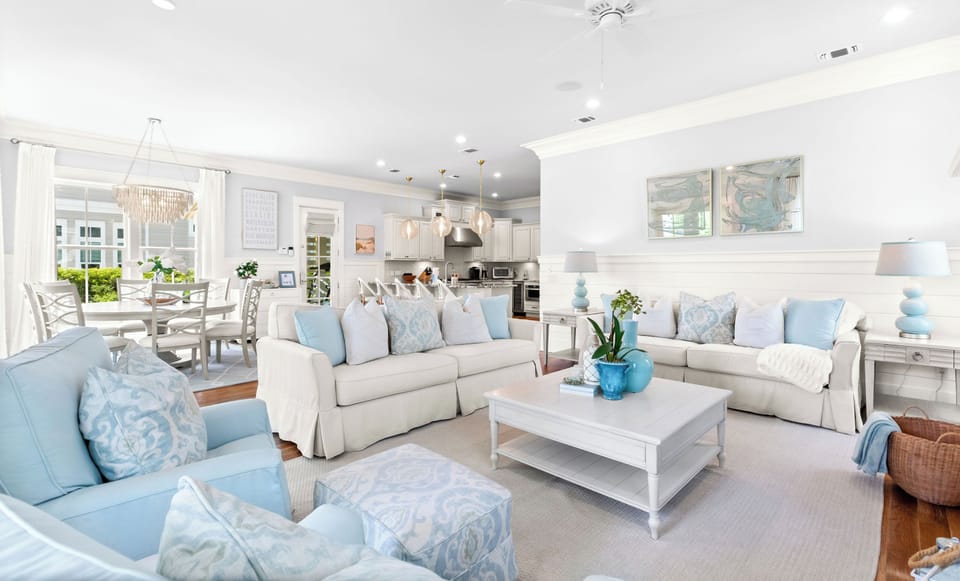 Unwind in this bright, airy open-concept space where soft blues and crisp whites create your perfect coastal retreat.