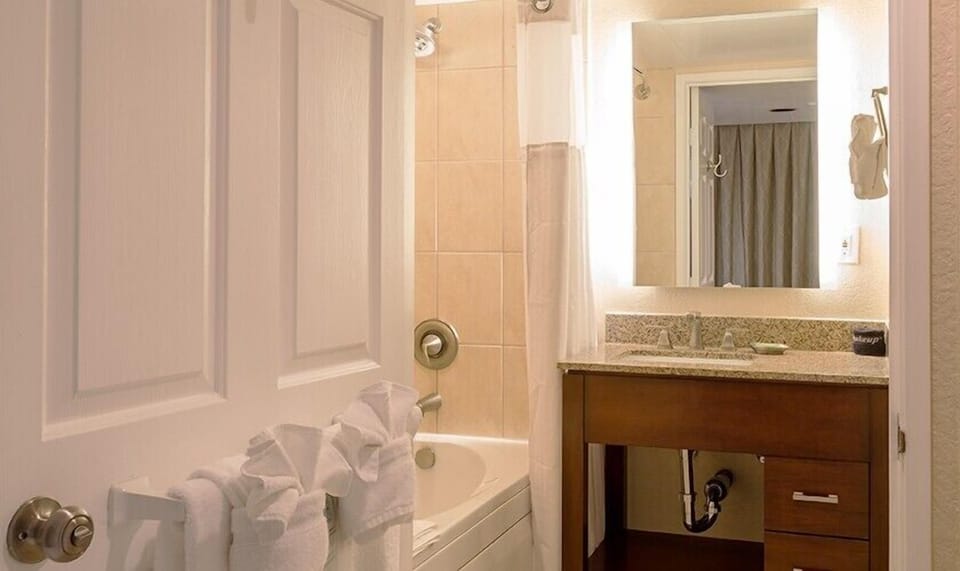 Soak and reset in a clean, classic tub-shower combo.