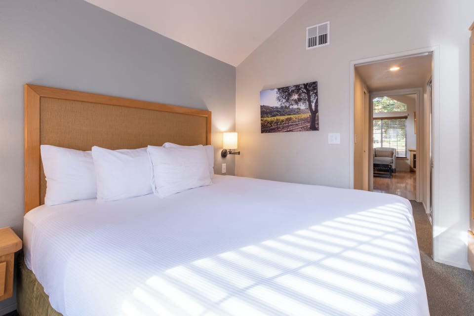 Settle in with a spacious bedroom layout and calm tones.