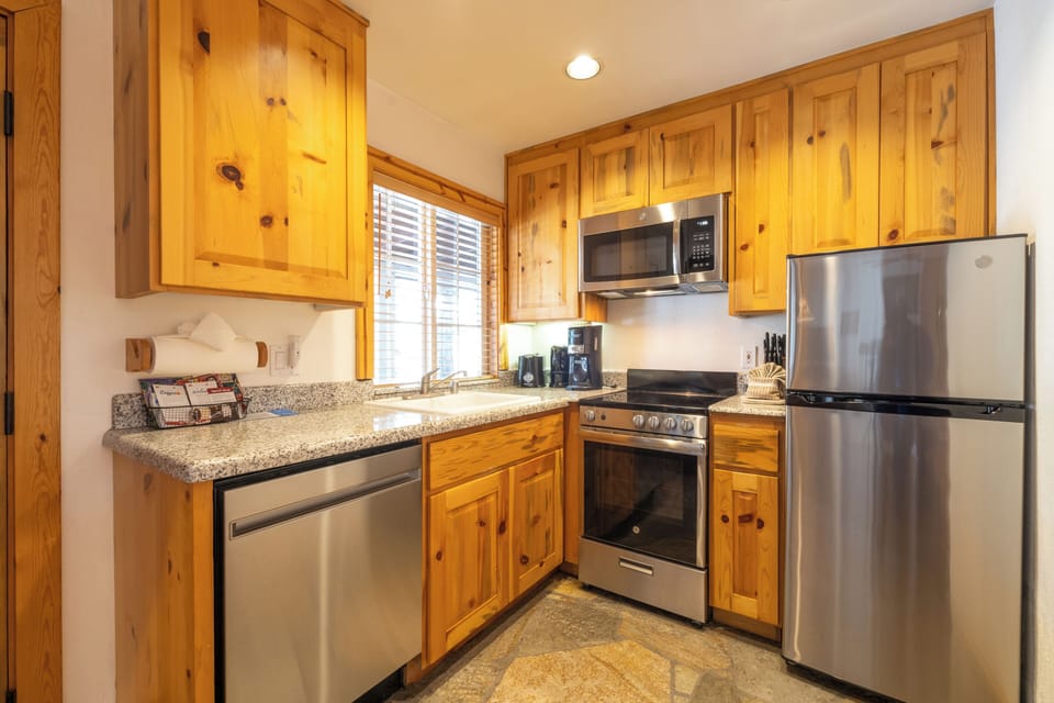 Cook easy meals in a bright kitchen with full appliances.