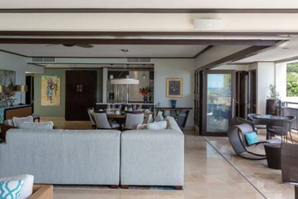 Open plan living space with comfortable seating and stunning views out to sea.