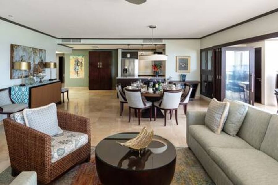 Open plan living space with comfortable seating and stunning views out to sea.