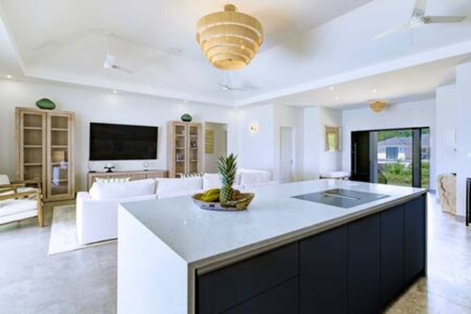 Beautifully light and airy open plan living area and kitchen, with fabulous views over the pool and sea beyond.