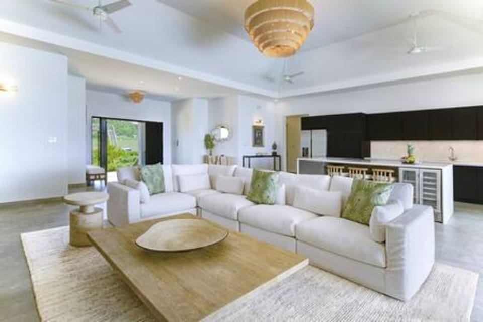 Beautifully light and airy open plan living area and kitchen, with fabulous views over the pool and sea beyond.