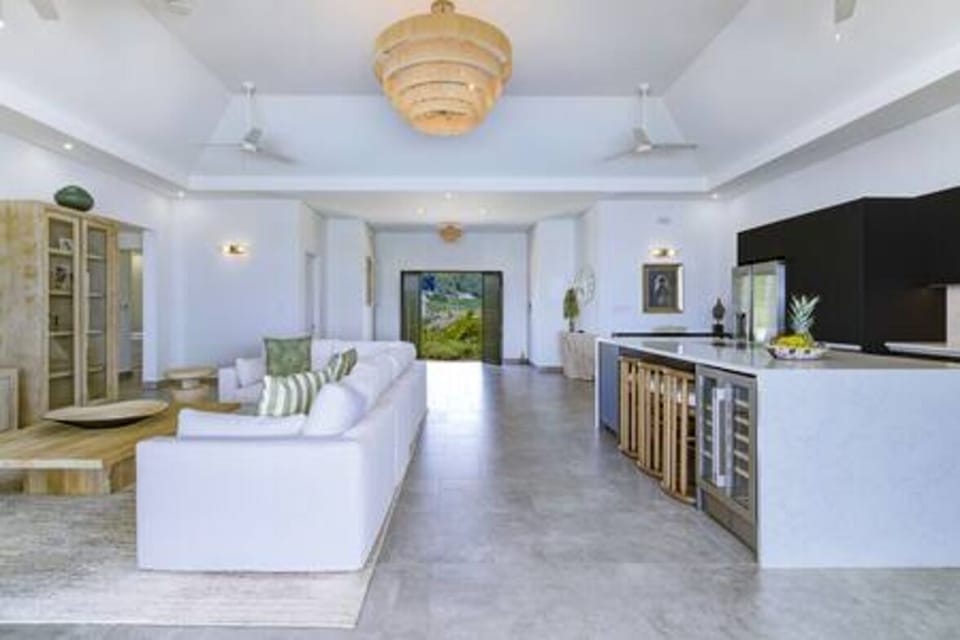 Beautifully light and airy open plan living area and kitchen, with fabulous views over the pool and sea beyond.