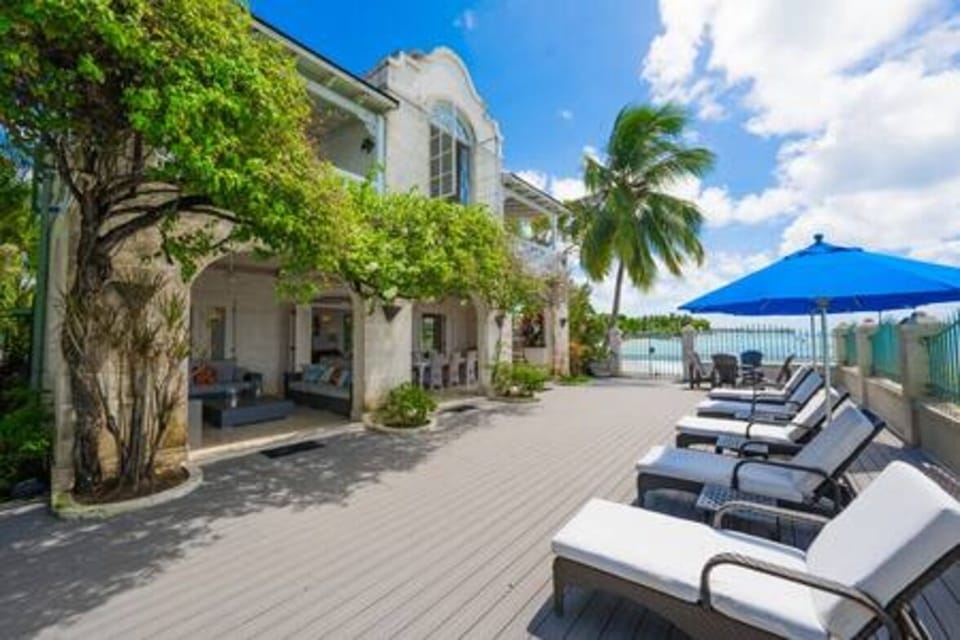 A stunning private deck area adjoining the private swimming pool and leading onto the beach.