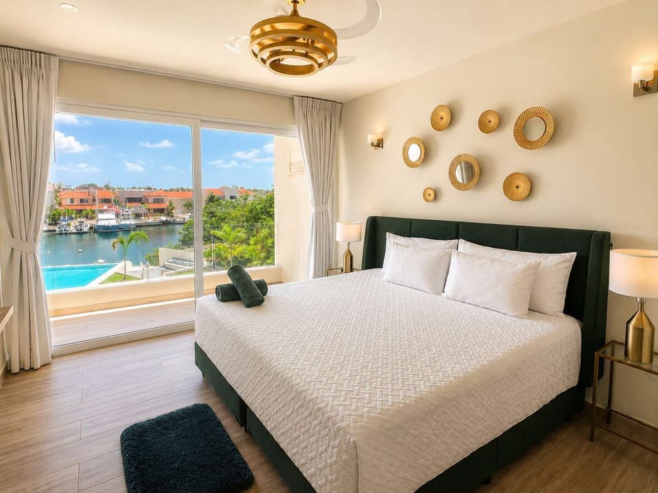 King bedroom with natural light, views, and a relaxing atmosphere.