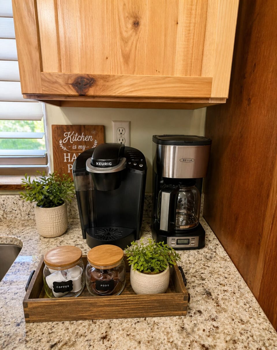 Fully stocked coffee station with Keurig and drip maker—perfect for your morning brew in a cozy cabin kitchen.