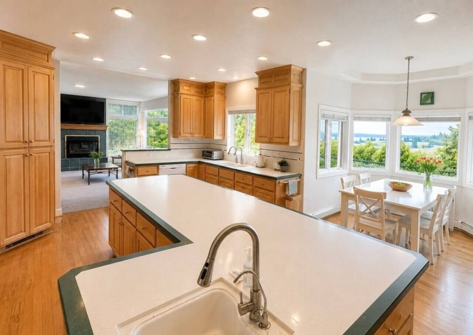 Second prep kitchen with island, breakfast bar and garden views