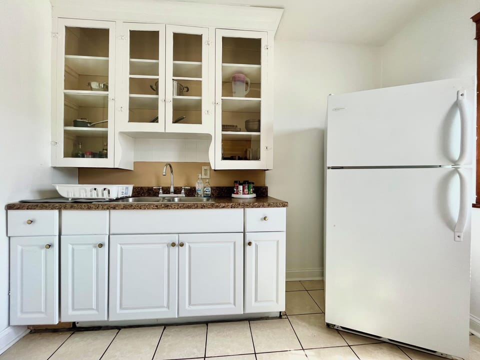 Kitchen is equipped with plates, cups, pots, pans and all the necessary cutlery 