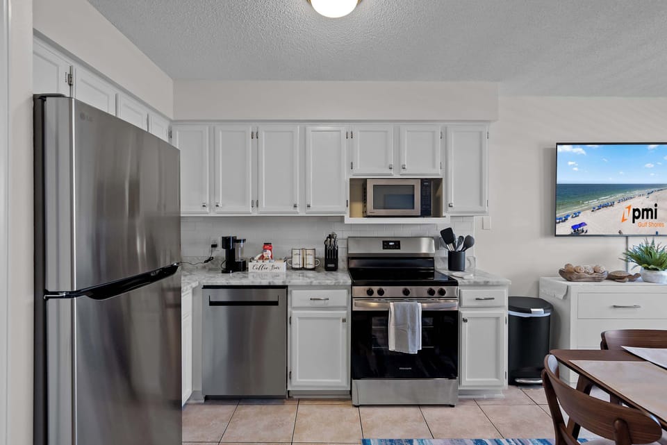 Updated kitchen with stainless appliances and fresh countertops