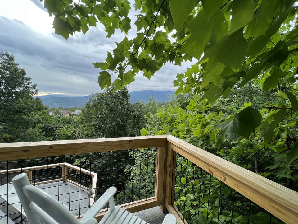 Upstairs mountain view private balcony (tree covered)
