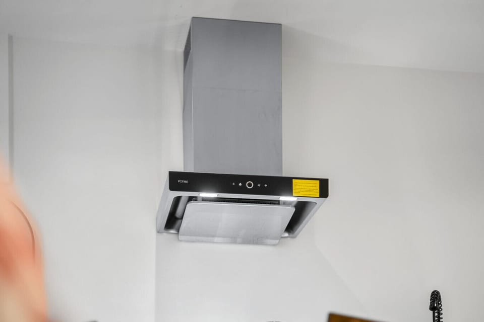 Kitchen: Sleek stainless-steel range hood for a stylish cooking experience!