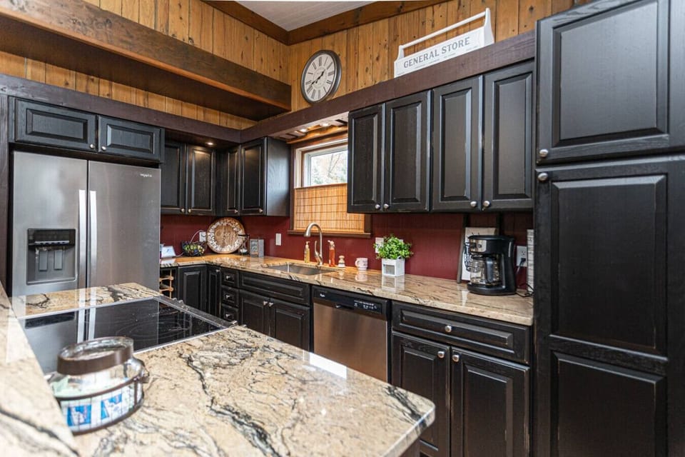 Fully stocked kitchen with plenty of space for cooking meals and hosting your group