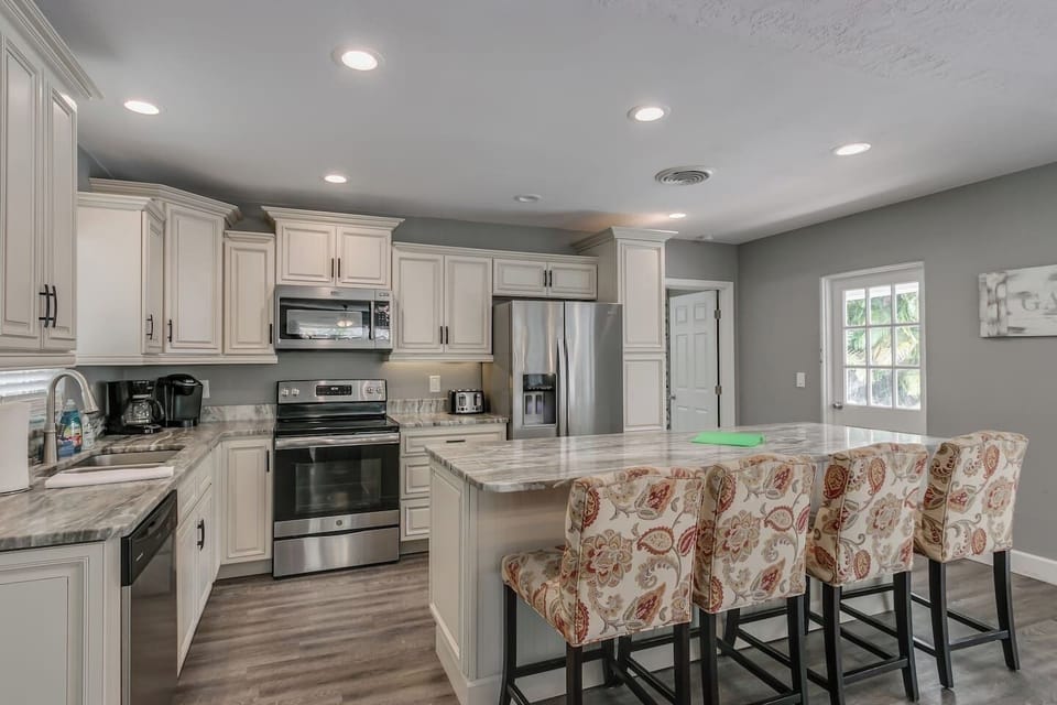 Prepare a Wonderful Meal in this Gorgeous Kitchen with Granite and Stainless Steel