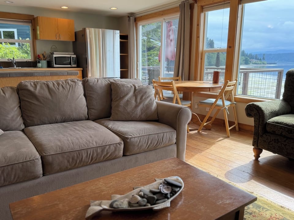 Living room and windows overlooking the Hood Canal. 