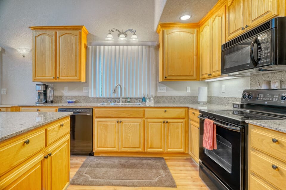 Bright kitchen with spacious counters, full appliances, and plenty of storage