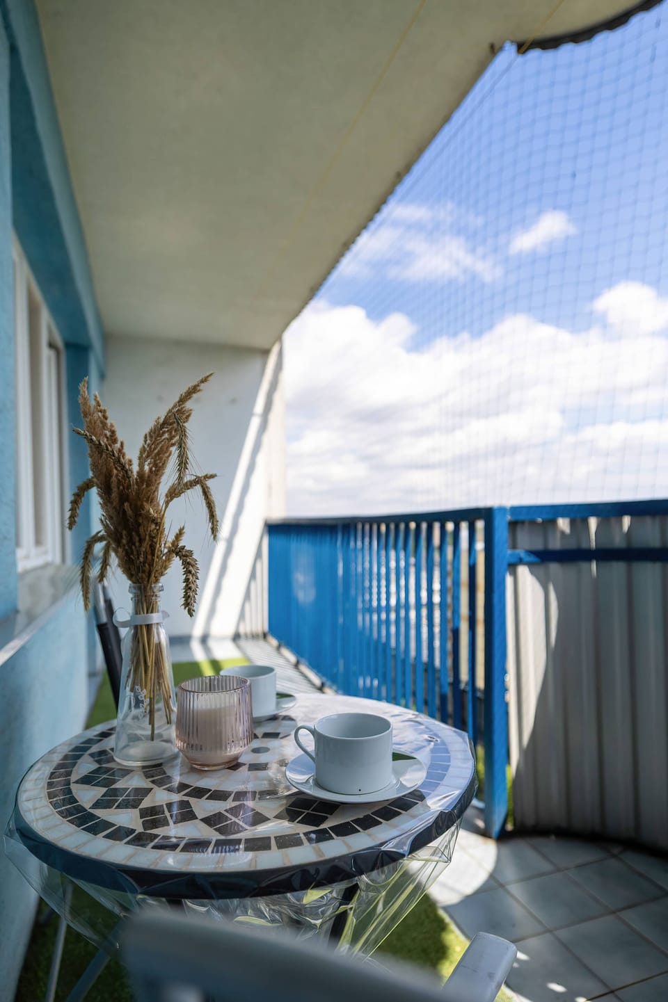 Balcony with panoramic city skyline and outdoor seating