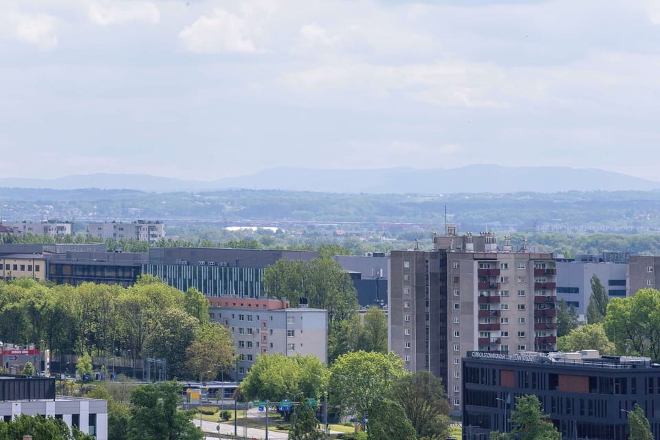 Panoramic city and mountain view from apartment window